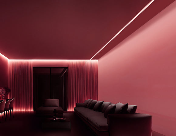 ceiling, positioned close to the wall. Designed with an angled light-emitting surface, it projects a precise beam that gently washes over the entire wall. The fixture is seamlessly embedded into the ceiling, maintaining a clean and modern aesthetic.