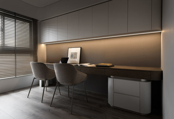 LED strip lights are used with an aluminum channel to create a unique lighting design for a home office.