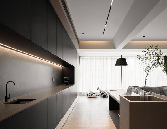 LED strip lights are used in an aluminum channel to create a unique lighting design in a space.