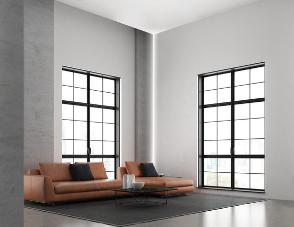 LED strip lights are used in an aluminum channel to illuminate a living room.