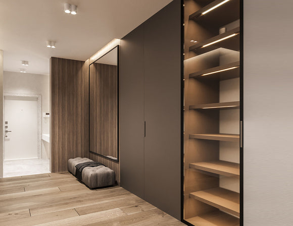 A natural toned hotel room is decorated with LED strip lights that are powered by a dimmable LED low voltage power supply. LED strip lights have many commercial and residential lighting design applications, including undercabinet light options and seamless LED strip designs.