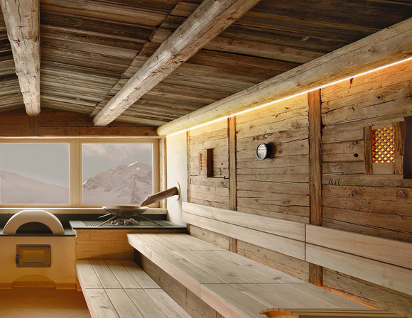 A sauna is decorated with wet rated IP 67 LED strip lights that are powered by a dimmable low voltage driver.
