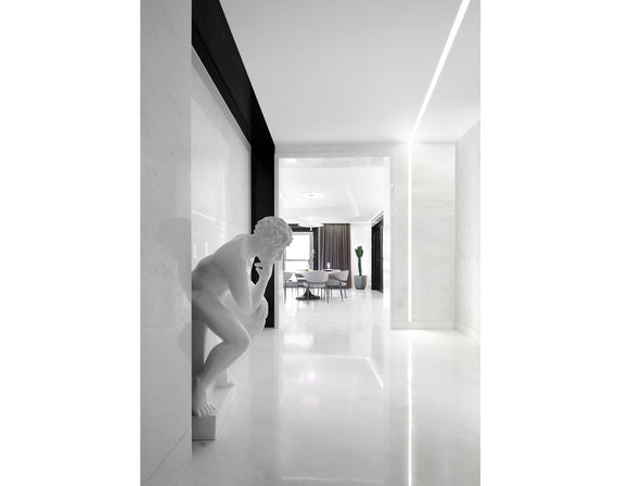 LED strip lights are used in an aluminum channel to create a unique lighting design in a living room.