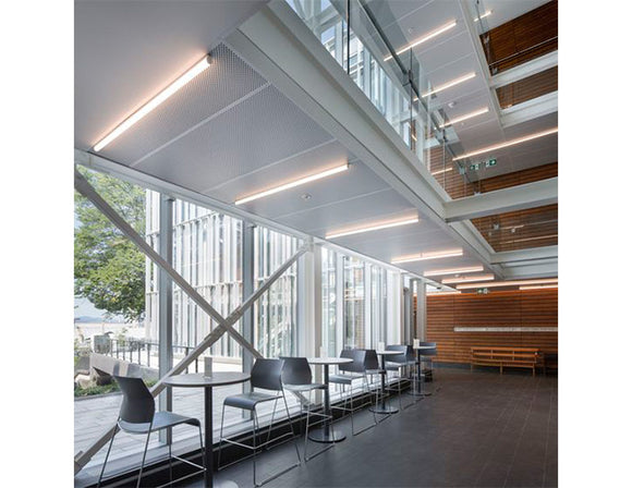 LED strip lights are used in an aluminum channel to create a unique lighting design for a seating area.