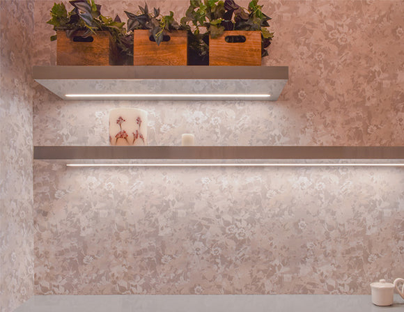 LED strip lights are used in an aluminum channel to illuminate shelving units.