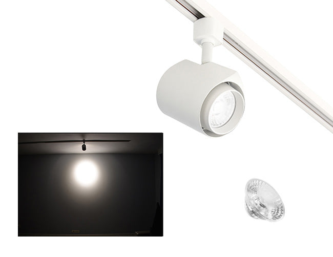 The image showcases the lighting effect produced by a white standard track light with a 24° lens, revealing a smaller and brighter circular light spot on the wall targeted by the track light.