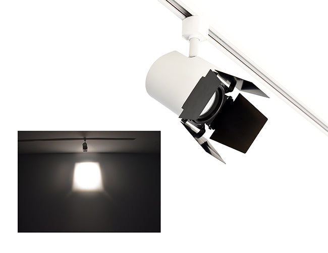 The image showcases the lighting effect produced by a white color track light with a barn door, revealing a distinct rectangular bright spot on the wall targeted by the track light.