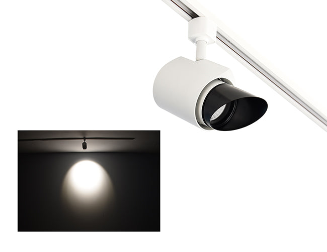 The image showcases the lighting effect produced by a white color track light with a ovalsnoot, revealing a stretched oval pattern bright spot on the wall targeted by the track light.