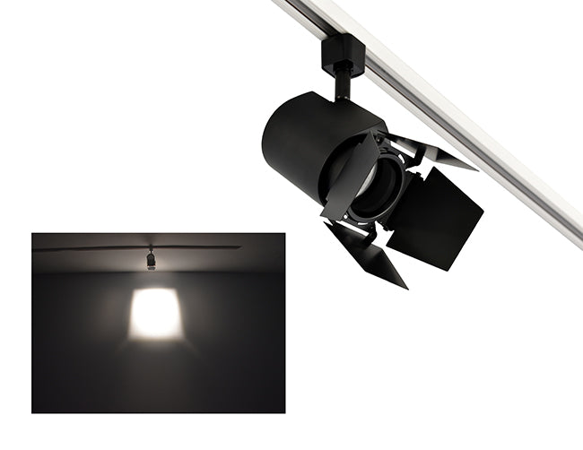 The image showcases the lighting effect produced by a track light with a barn door, revealing a distinct rectangular bright spot on the wall targeted by the track light.