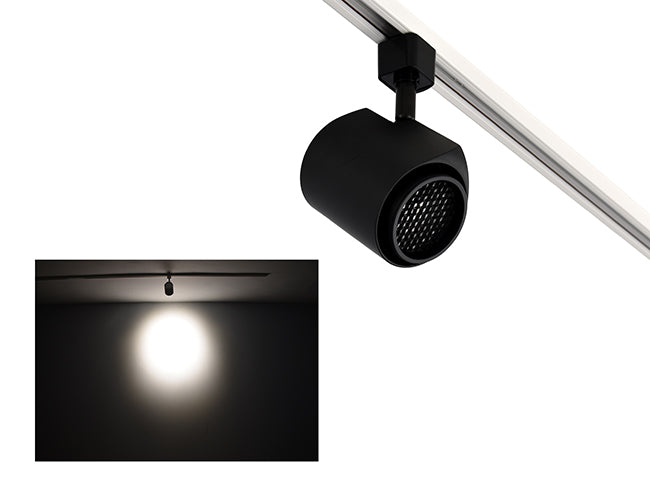 The image showcases the lighting effect produced by a track light with honeycomb, revealing a distinct circular bright spot on the wall targeted by the track light.