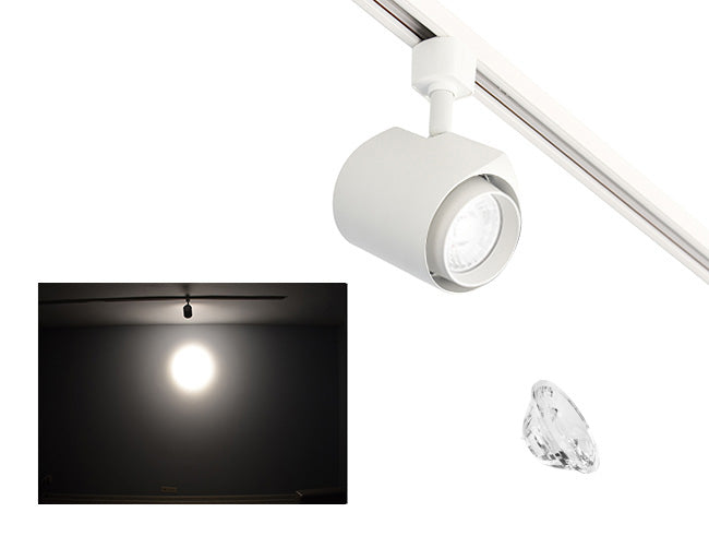 The image showcases the lighting effect produced by a white standard track light with a 15° lens, revealing a smaller and brighter circular light spot on the wall targeted by the track light.