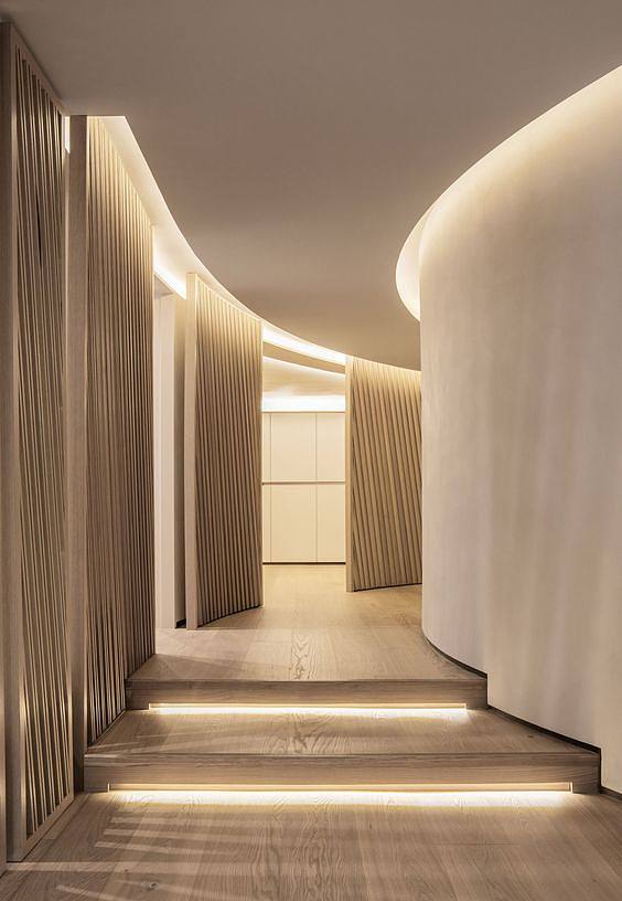 A hallway is illuminated by COB LED strip lights.