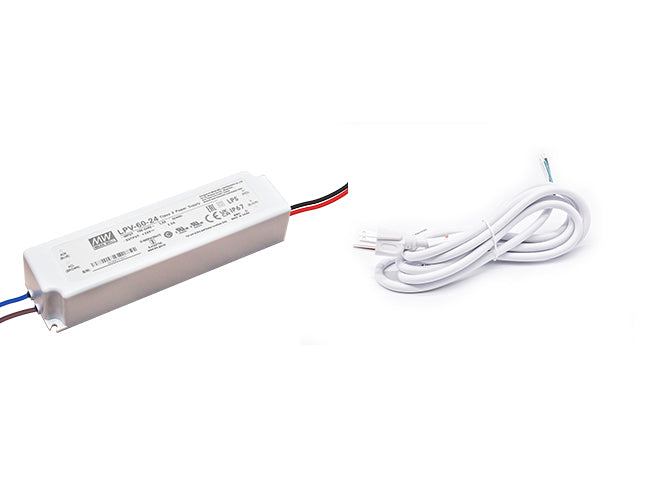 A Mean Well 60W 24VDC LED transformer with a white three-prong power cord for line voltage.