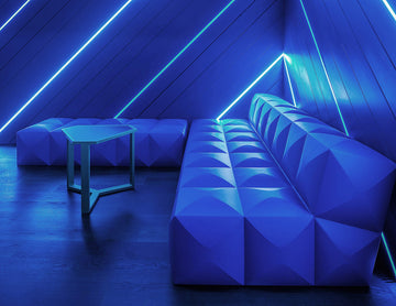 A seating area is decorated with blue LED strip lights that are powered by a dimmable low voltage transformer.
