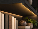 GLQ 2207B Black Aluminum Channel installed under a dark wood shelf, providing warm indirect LED lighting for bookshelves and architectural displays.