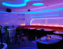 A bar lounge is decorated with RGB LED strip lights that are powered by a dimmable low voltage transformer.