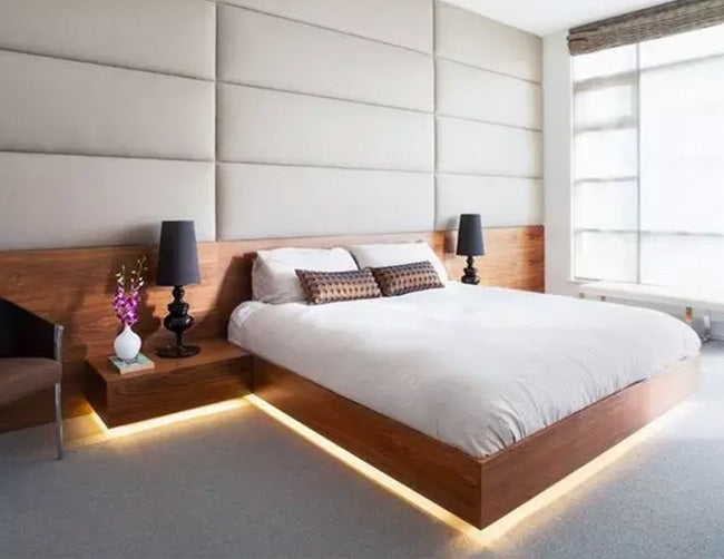 A bedroom is decorated with ambient LED strip lights that are powered by a dimmable low voltage transformer. 