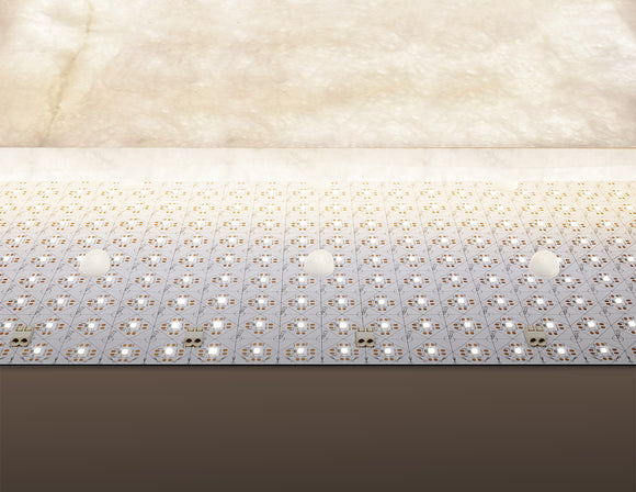LED light sheet with integrated stand-off spacers, keeping the lighting panel safe from direct contact with surfaces such as stone or glass.