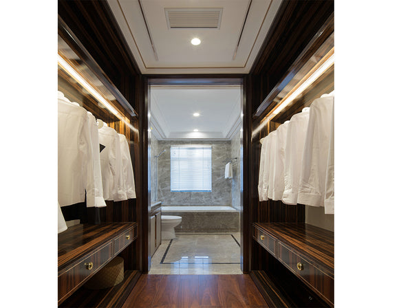 LED strip lights are used in an aluminum channel to create a unique lighting design for a walk-in closet.