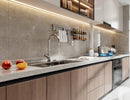 LED strip lights are used in an aluminum channel to create a unique lighting design for kitchen undercabinets.