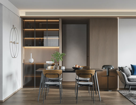 LED strip lights are used in an aluminum channel to create a unique lighting design in a kitchen.