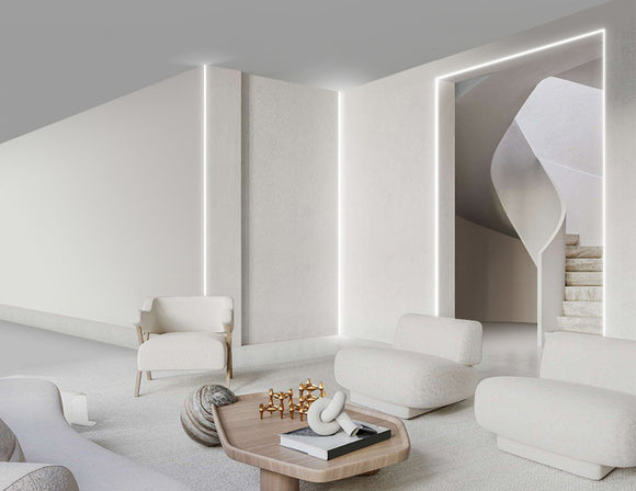 LED strip lights are used in an aluminum channel to illuminate a living room.