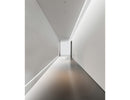 LED strip lights are used in an aluminum channel to illuminate a hallway.