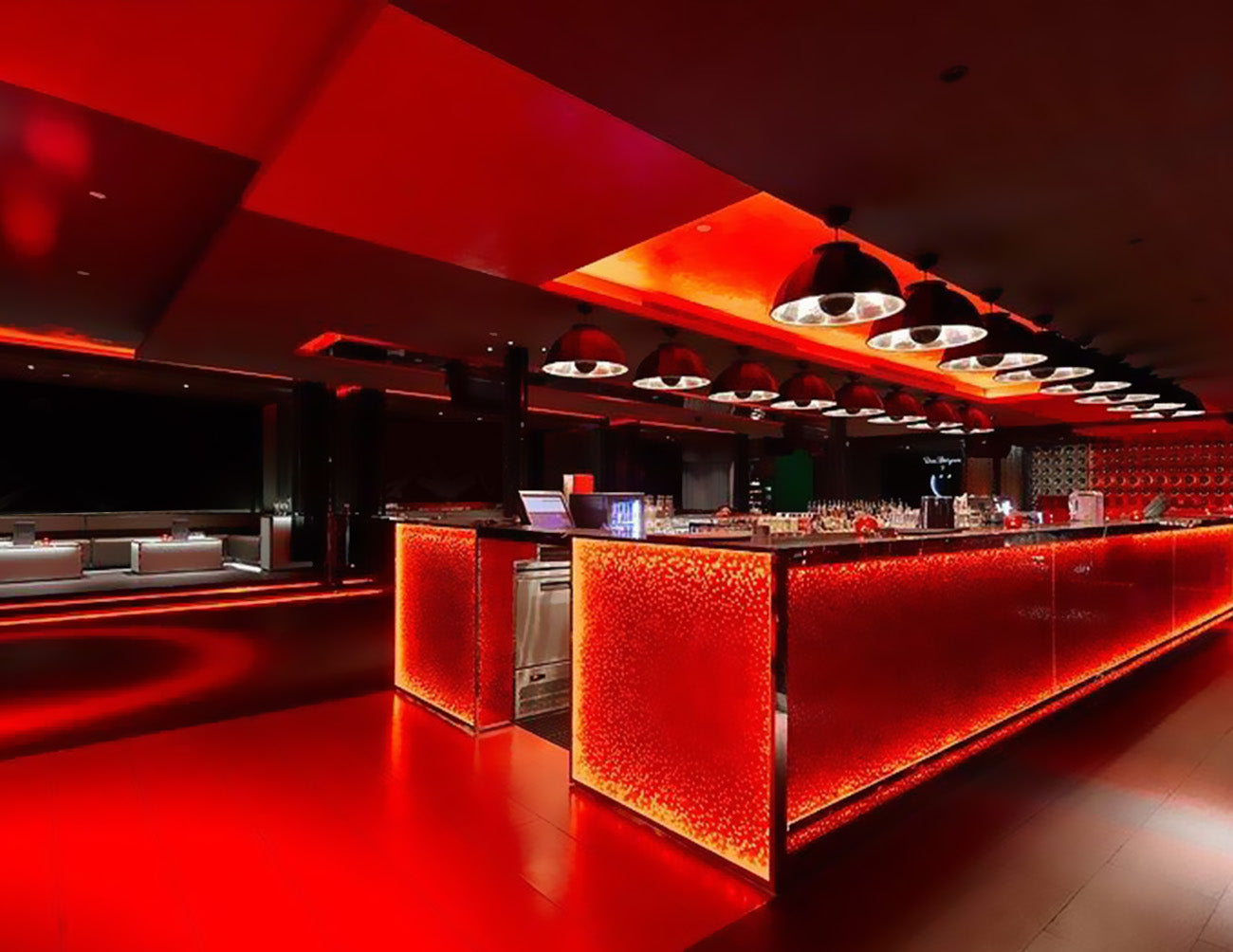 LED Strip Light - Single Color - Ultra Bright - LEGEND RED - Dry Location IP20 - 24V installed in the bar emit red light, creating a vibrant and energetic atmosphere while adding style and vitality to the space.