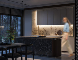 PIR motion sensor undercabinet LED strip lighting integrated beneath modern kitchen cabinets, providing automatic 3000K warm white linear task illumination for residential architectural projects