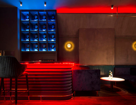 A bar is decorated with RGB SPI LED strip lights that are powered by a dimmable low voltage transformer.