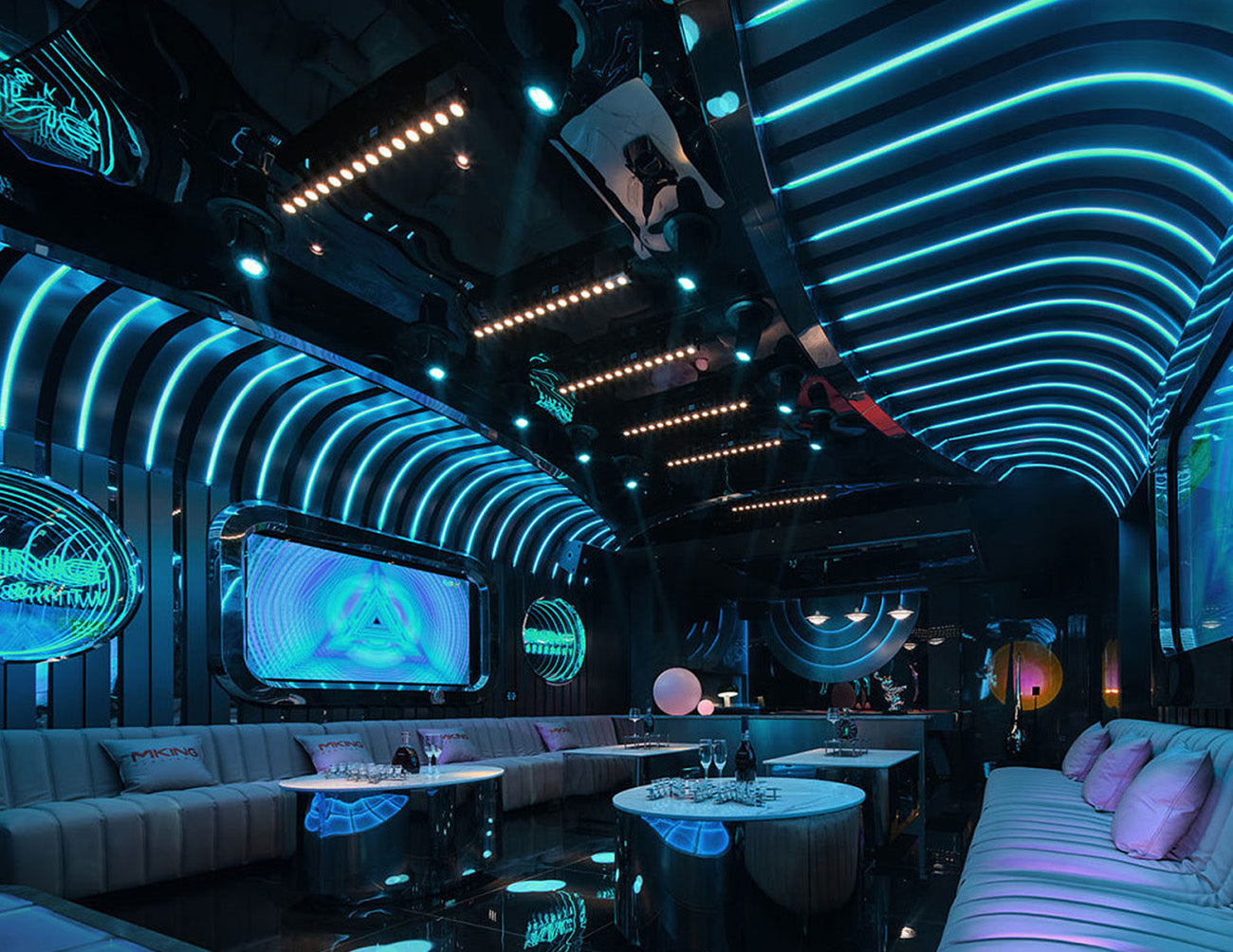 A bar is decorated with wet rated RGB LED strip lights that are powered by a low voltage transformer.