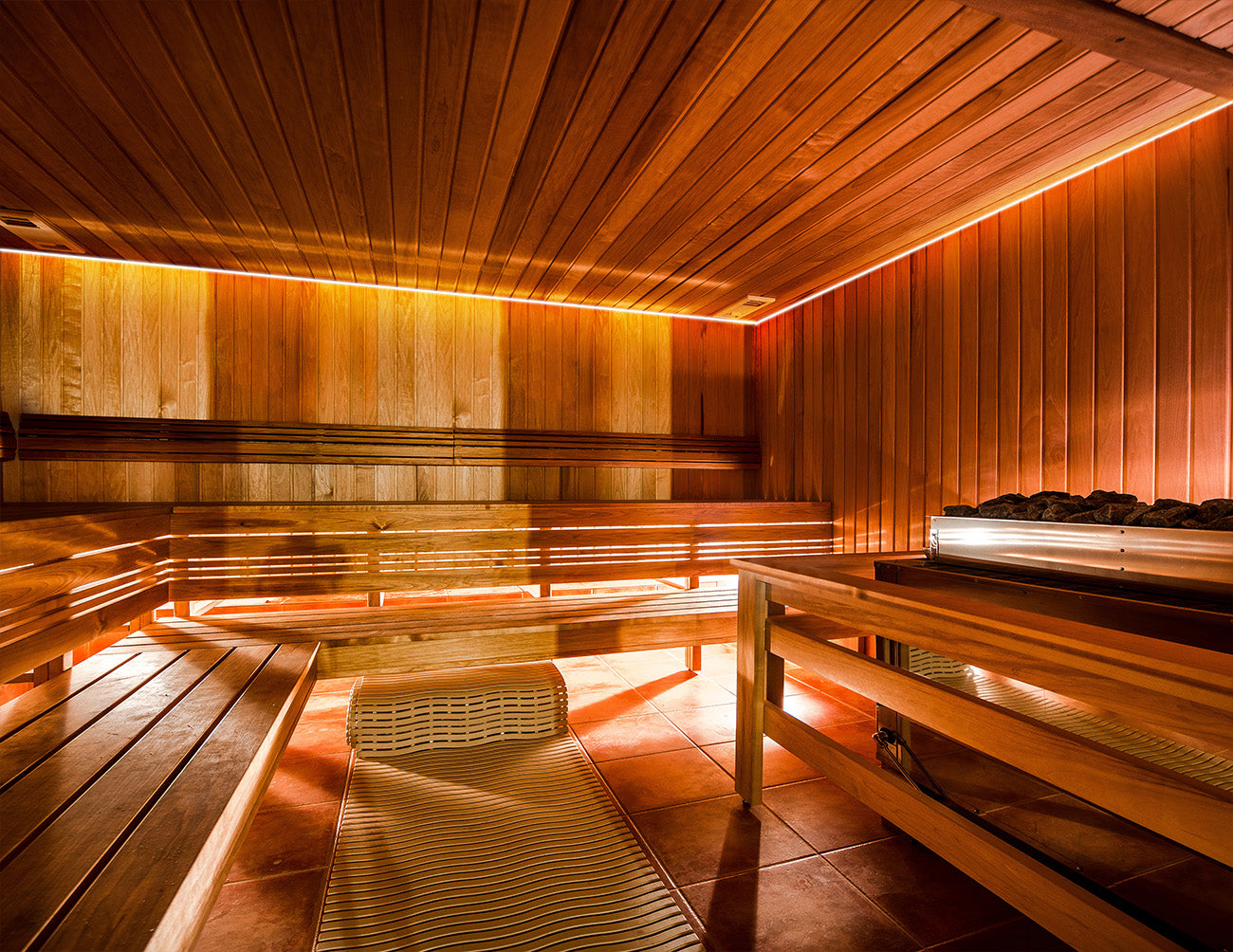 GL LED Sauna COB strip lights are installed in a sauna room as cove lighting.