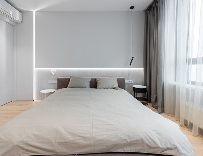 LED strip lights illuminate a bedroom.