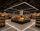 GL LED US LIGHTING T Shape LED Linear Light illuminating a large commercial retail space with suspended branching linear fixtures.
