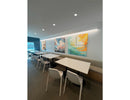 Wall-mounted honeycomb LED light in restaurant offering uniform and comfortable illumination