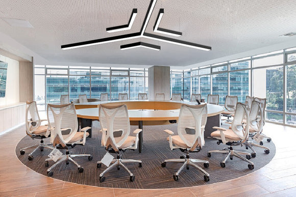 Architectural Y-shape suspended linear LED light creating uniform ceiling illumination in modern office meeting space
