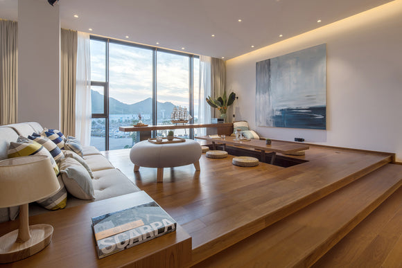 CORNER WALL WASHER - GLQ 9758 Aluminum Channel providing seamless wall wash lighting in an open-plan living room, enhancing architectural surfaces with uniform indirect illumination and concealed linear lighting design.