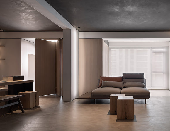 Indirect wall wash lighting effect created by round aluminum LED strip channel in architectural interior space
