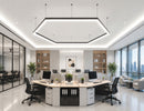GL LED US LIGHTING L8070 LED Linear Light with Milky Flat Lens and 120° L Shape connectors, creating a suspended geometric lighting design above a modern open office workspace.