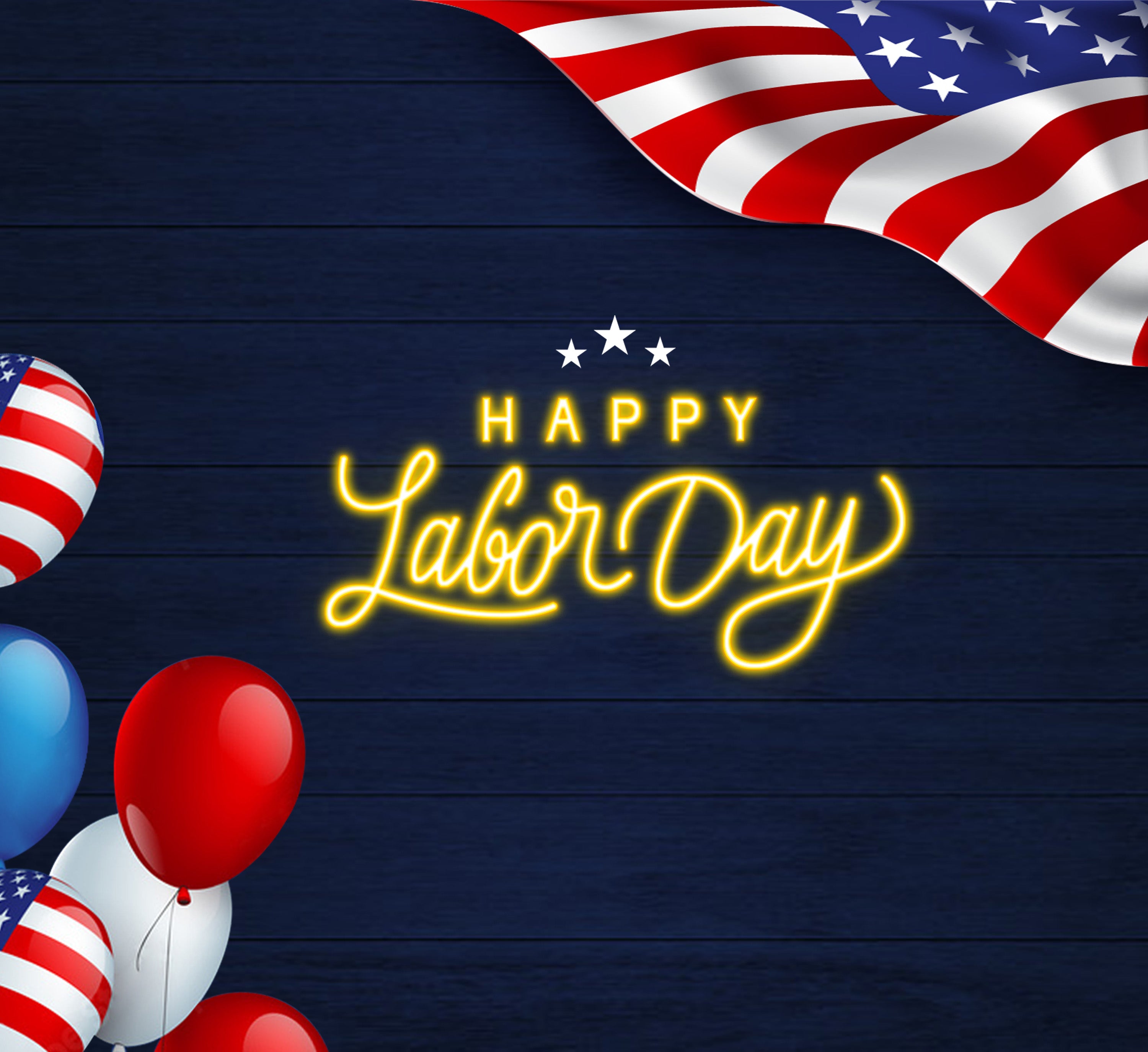 Illuminated 'Happy Labor Day' sign crafted from vibrant LED lights, accompanied by a prominent US flag and an array of celebratory US flag balloons.