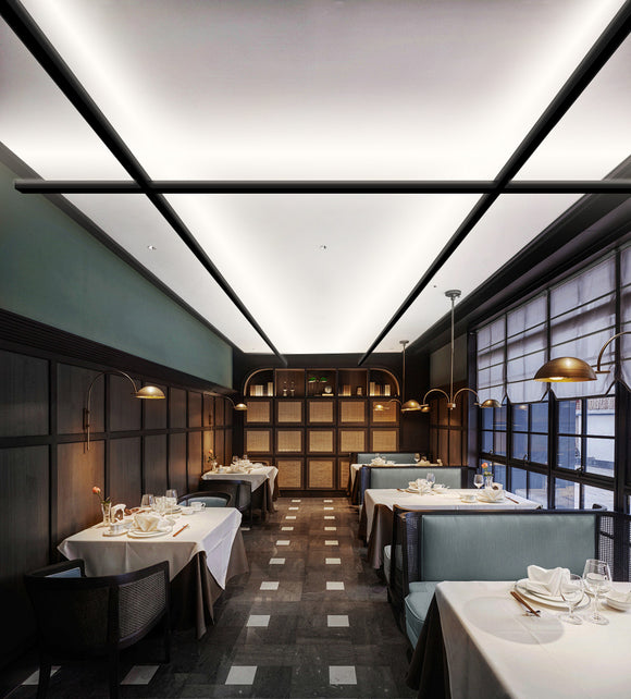 LED linear strip light L8070 X-shape ceiling up light creating uniform indirect architectural lighting in a modern restaurant interior