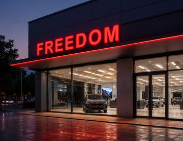 Car showroom storefront illuminated by LED Mini Module - Red, delivering vibrant red channel letter lighting for commercial signage and architectural branding applications.