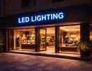 LED Module Light illuminated boutique storefront signage with blue backlit lightbox, applied in modern retail architectural lighting design