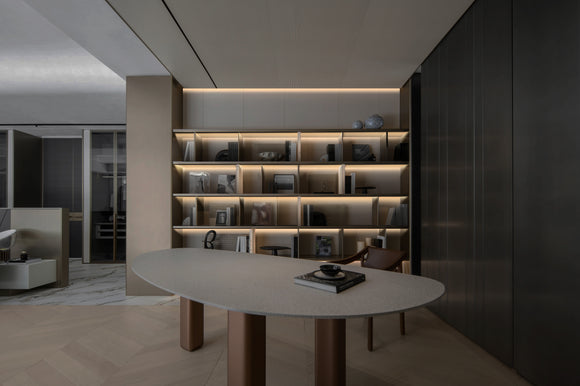Hidden under cabinet LED strip light installed in aluminum channel, providing soft shelf lighting for modern interior architectural lighting design.