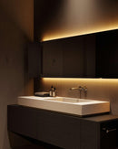 White COB LED strip light creating soft backlit mirror lighting in a modern bathroom vanity, architectural lighting application by GL LED US LIGHTING.