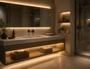Modern bathroom vanity illuminated with GL LED US LIGHTING LED Strip Light - COBCC3 White - IP67, providing seamless dot-free 3500K warm white illumination around the mirror, under the floating cabinet, and inside recessed wall niches. The IP67 waterproof COB LED Strip Light delivers uniform architectural lighting performance for humid bathroom environments, creating a clean, premium spa-like atmosphere ideal for residential and hospitality projects.