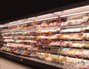 Magnetic Shelf Power Distribution Track integrated into refrigerated retail shelving, providing continuous power and uniform LED illumination for supermarket product displays.