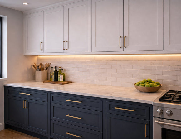 Recessed undercabinet LED strip lighting integrated beneath modern kitchen cabinetry, providing uniform 3000K warm white task illumination for residential architectural lighting projects