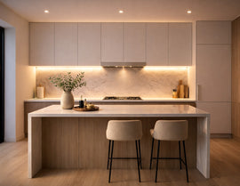 Recessed undercabinet LED strip lighting integrated beneath modern minimalist kitchen cabinets, providing uniform 3000K warm white linear task illumination for residential architectural lighting projects