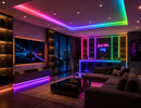 RGB SPI LED Strip - Digital Color-Chasing LED Tape Light integrated into a luxury home entertainment lounge with multicolor ceiling, media wall and bar lighting.